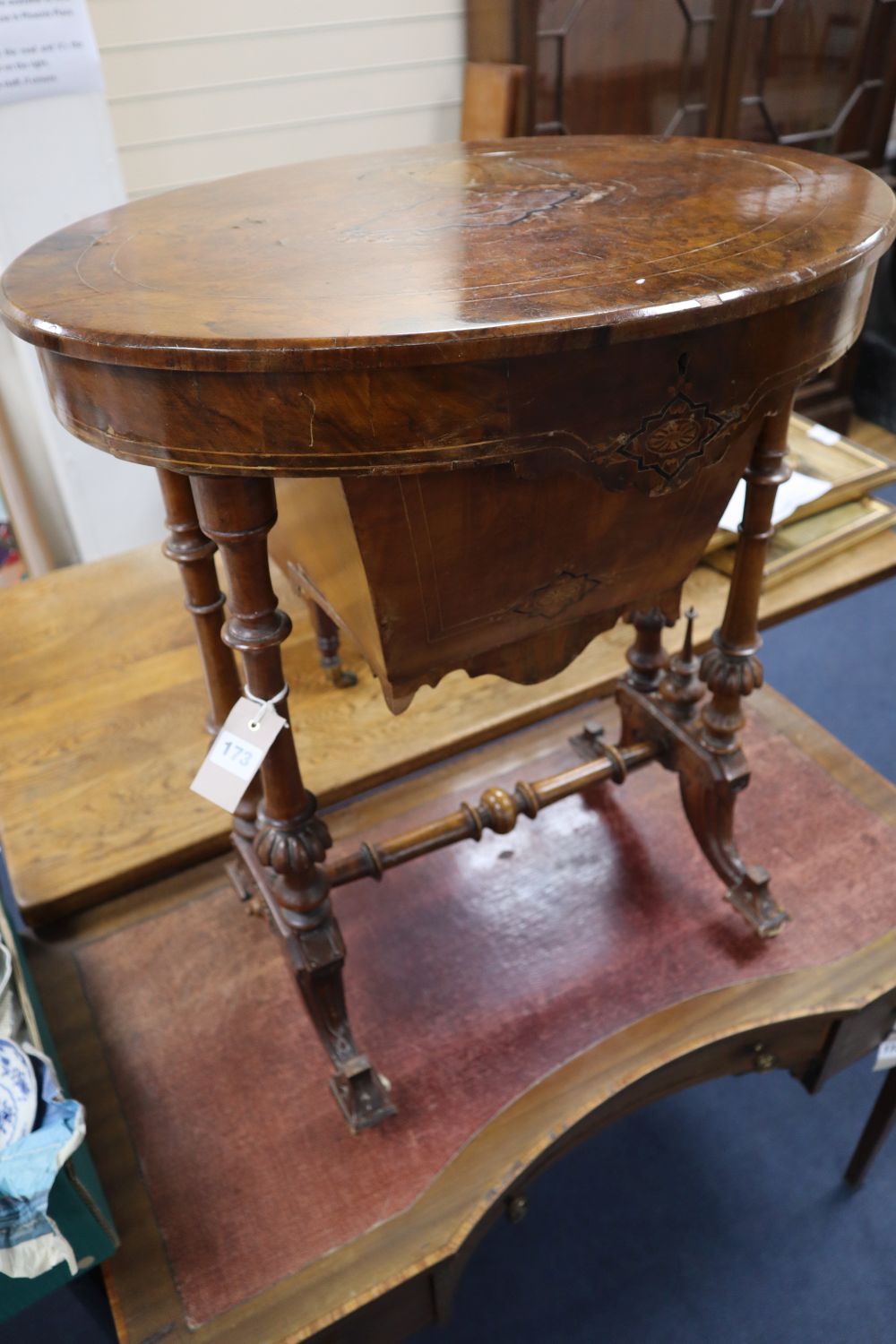 A Victorian inlaid walnut work table, with oval top, width 60cm